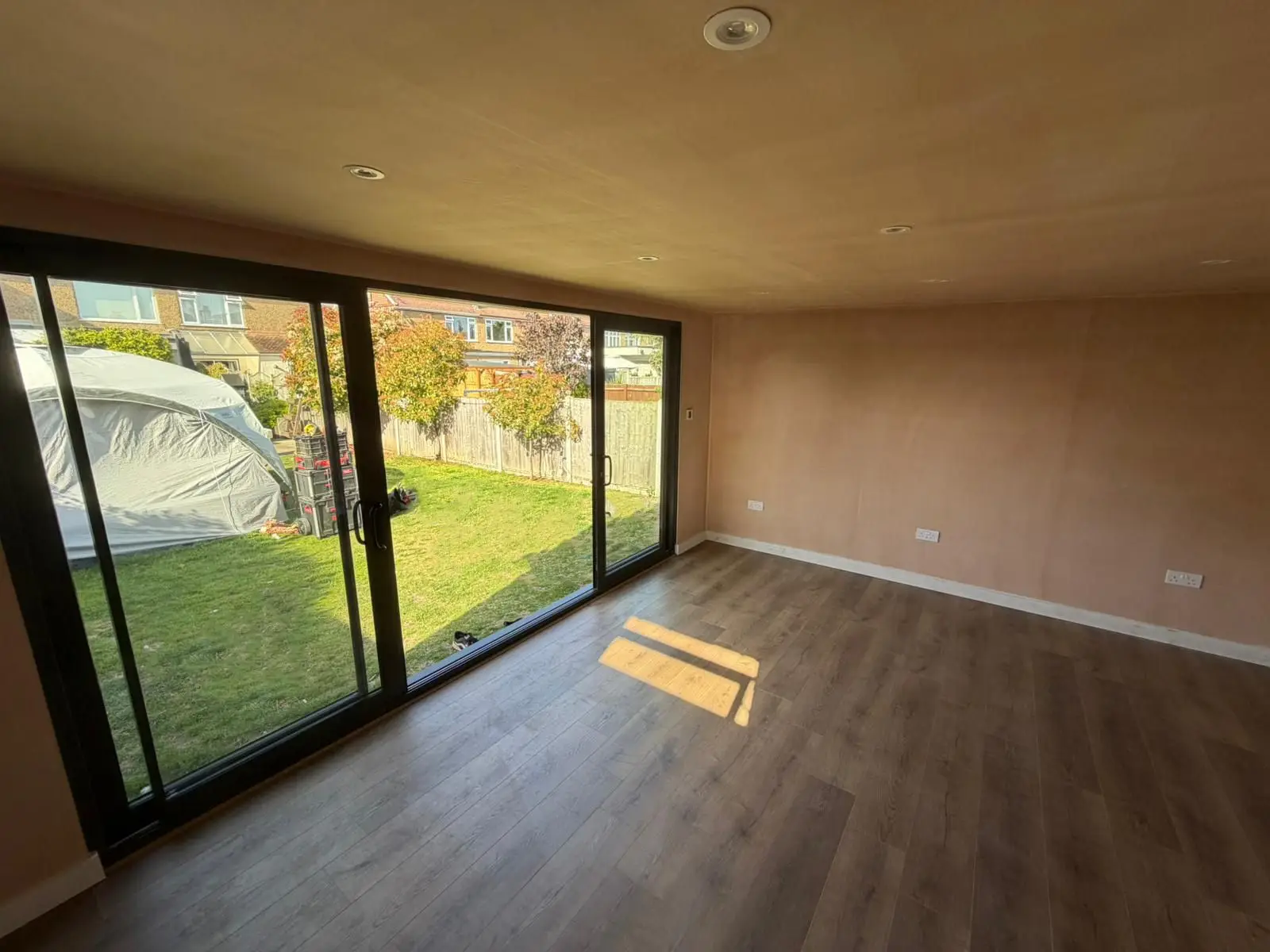 Garden office interior with sliding doors, Surrey