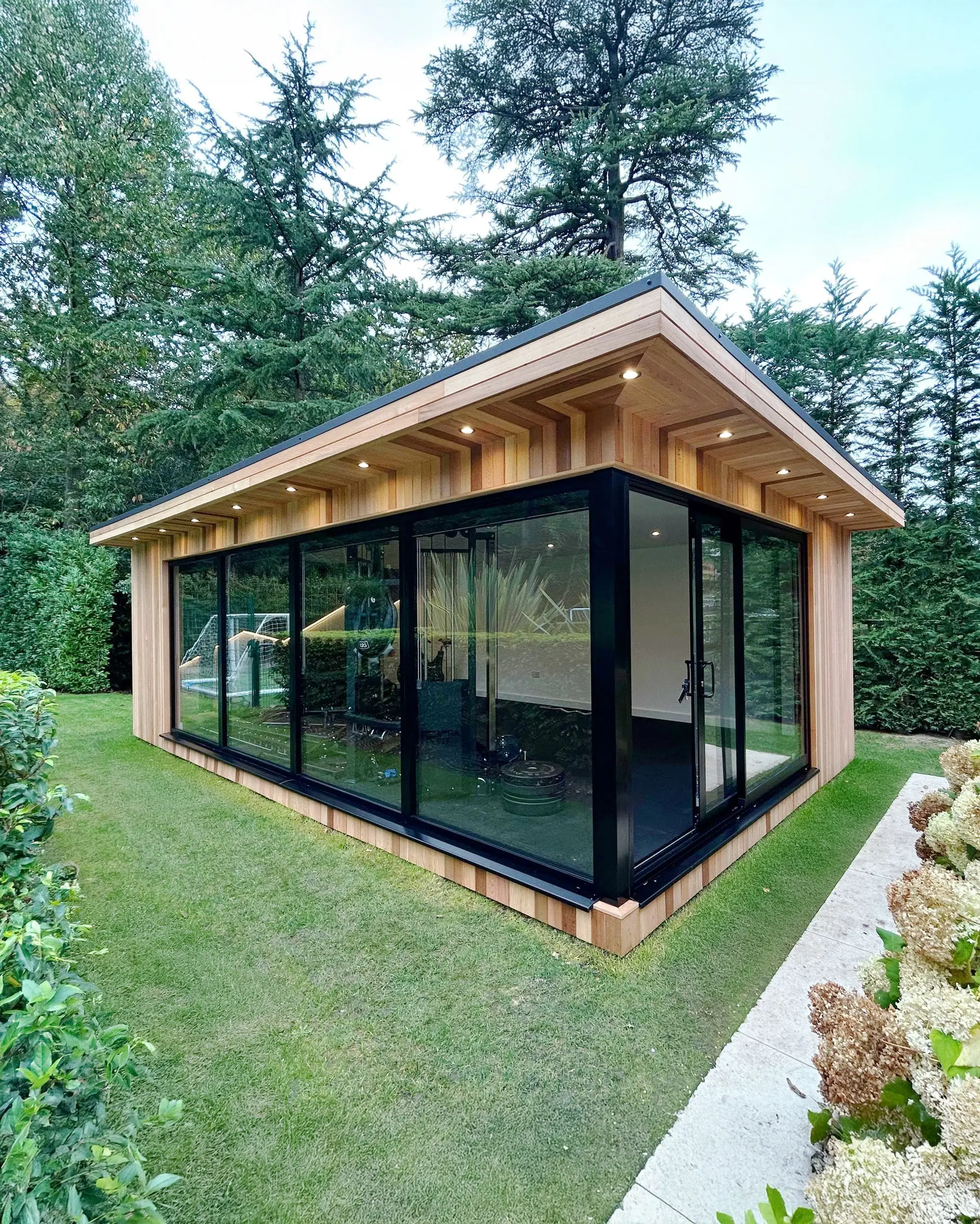 Garden room with dual canopy and glass corner