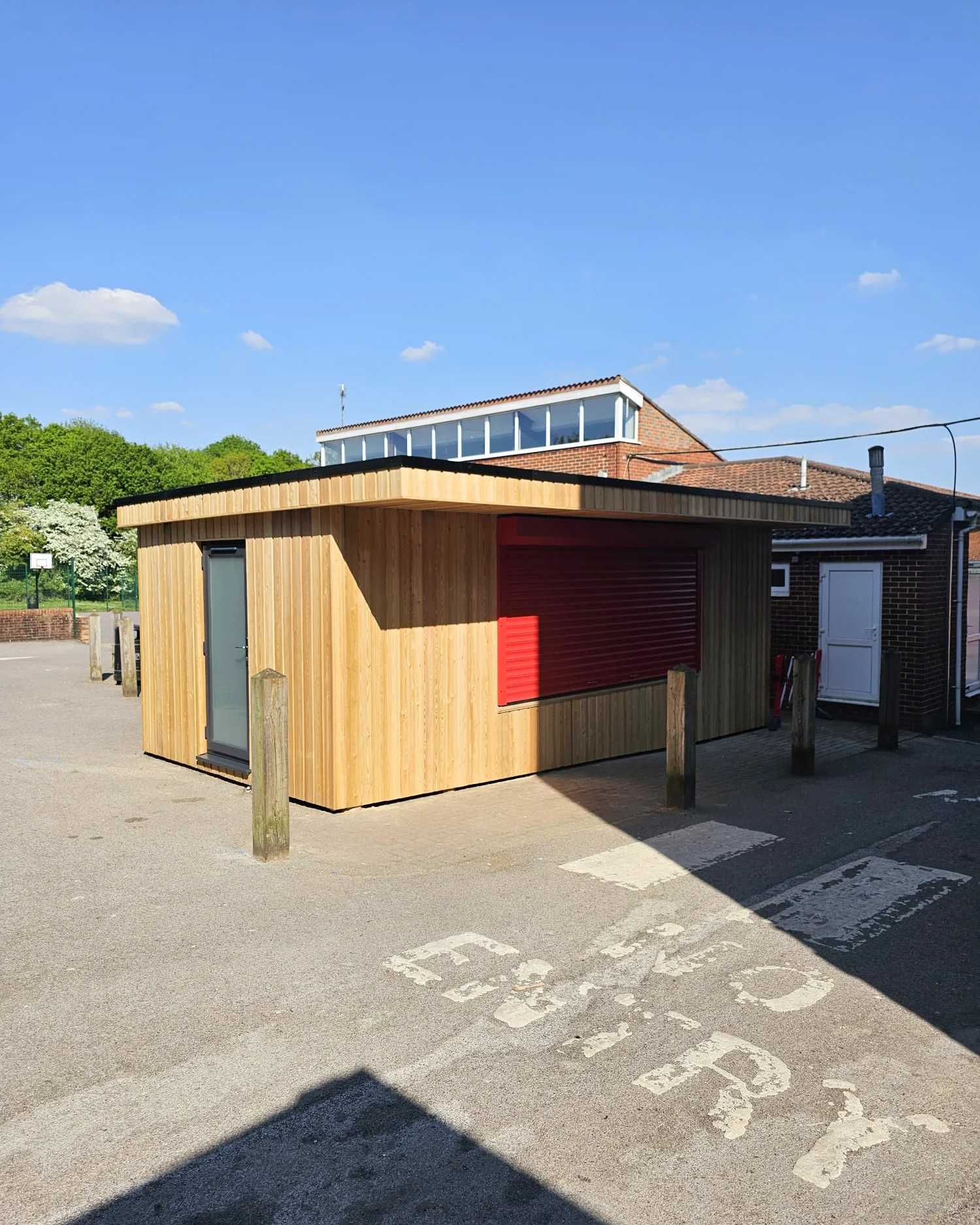 School canteen interior — hygienic wall cladding and dark laminate flooring