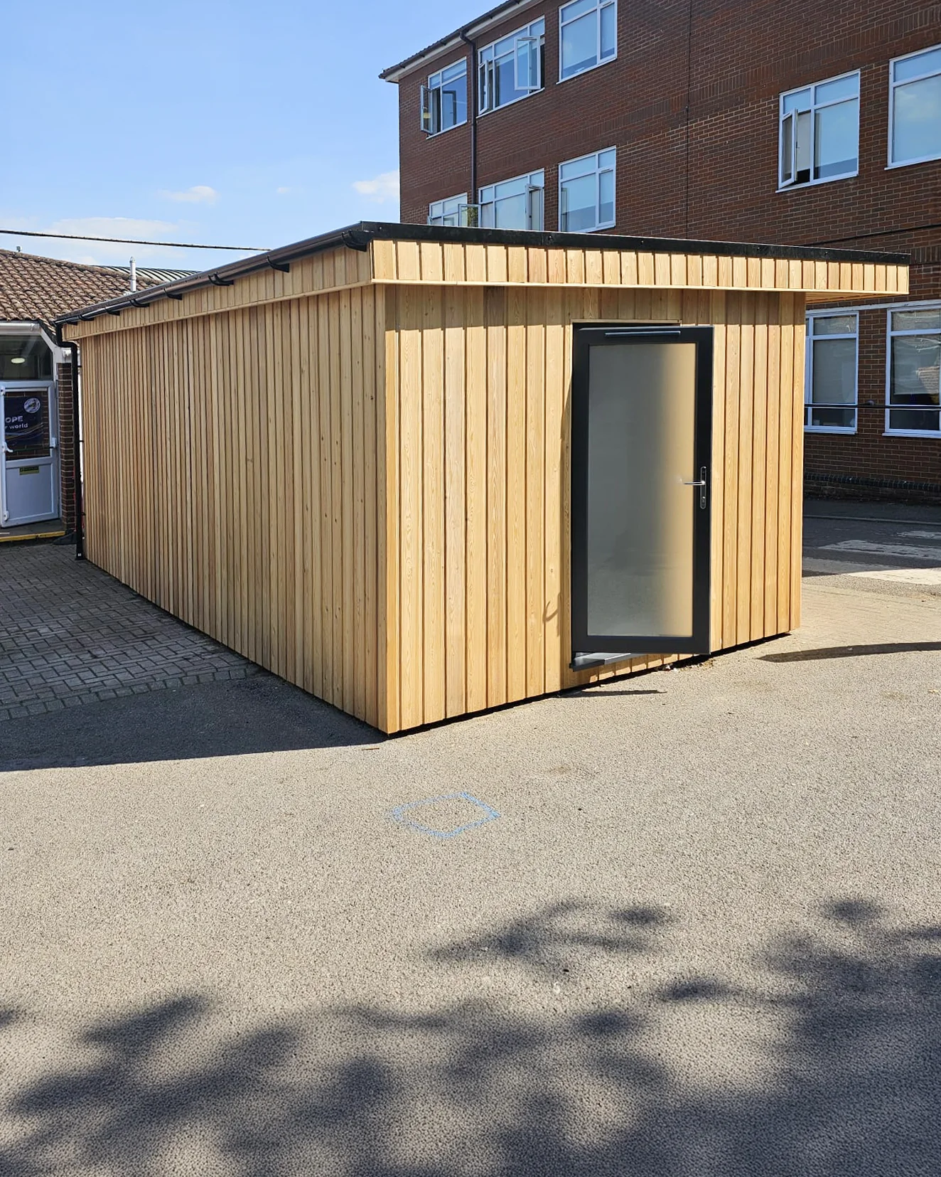 School canteen servery side elevation — Siberian Larch cladding