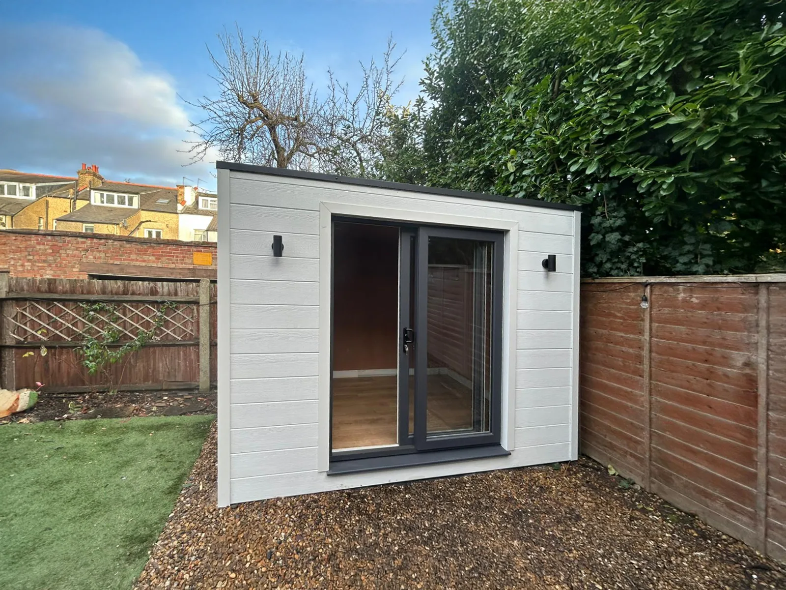 Compact garden pod — Hardie Plank Arctic White cladding, side view