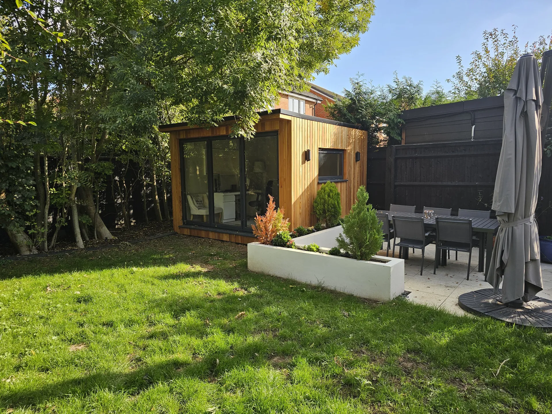 Garden office interior — plastered walls, fitted flooring, natural light