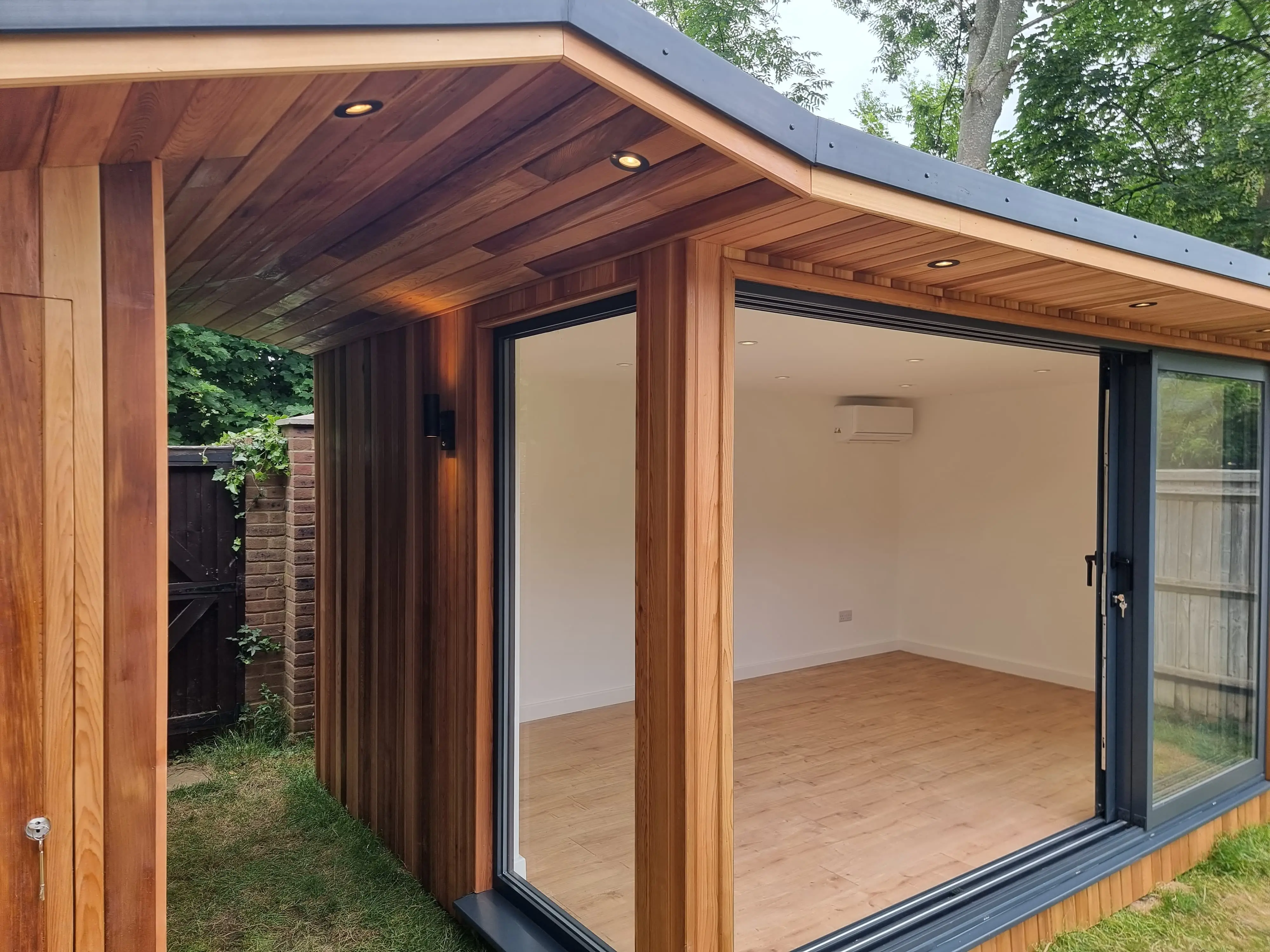 Bespoke garden room — glass corner detail and sliding doors