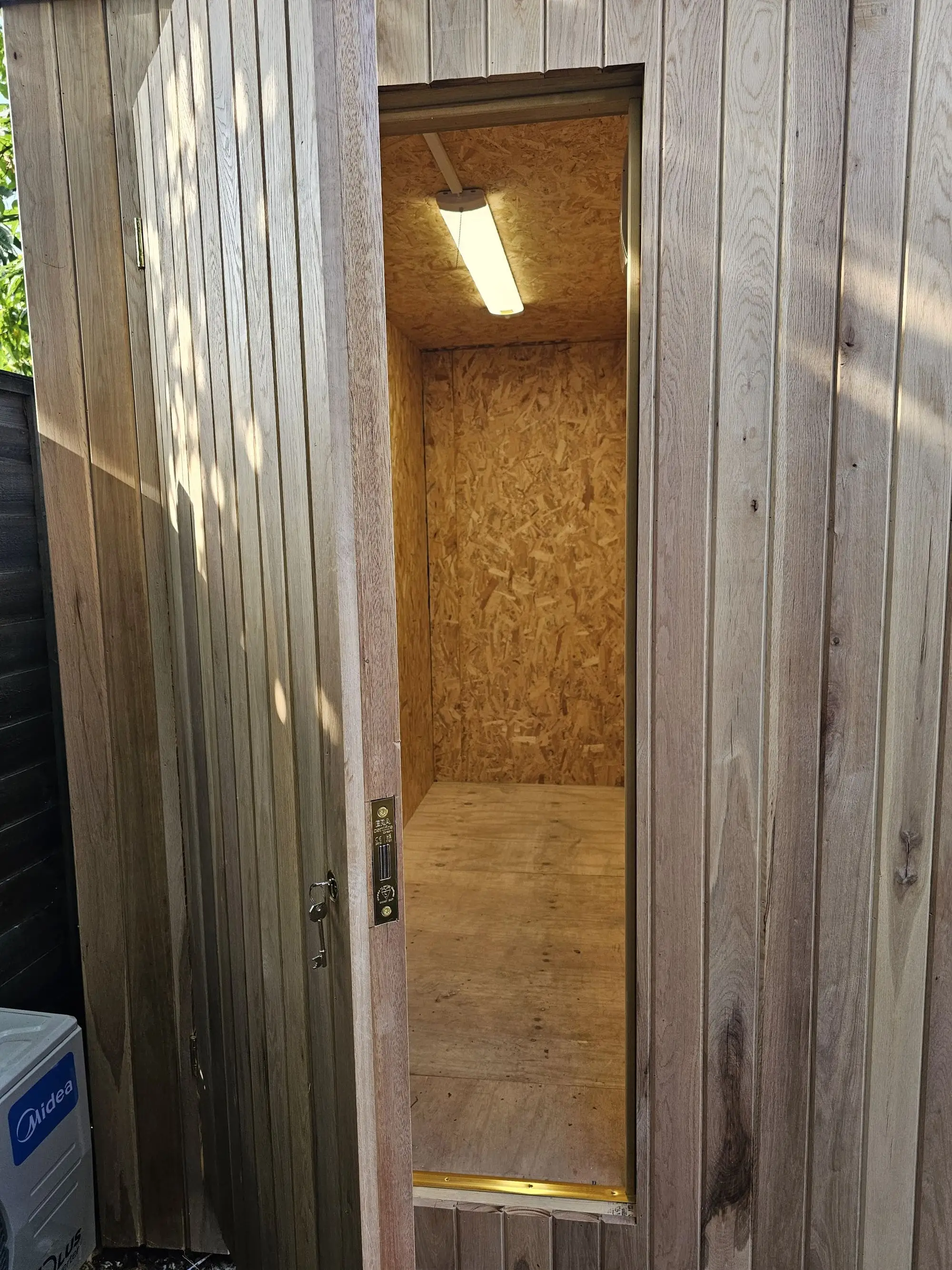 Hidden storage room door on garden room