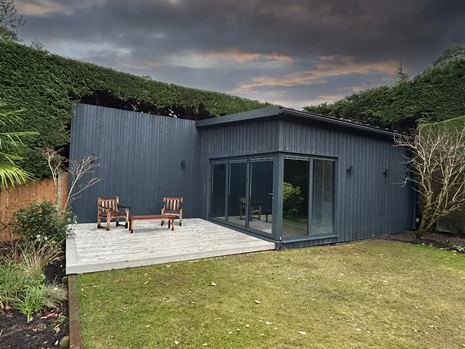 Golf simulator studio exterior — Millboard board and batten cladding, Woking