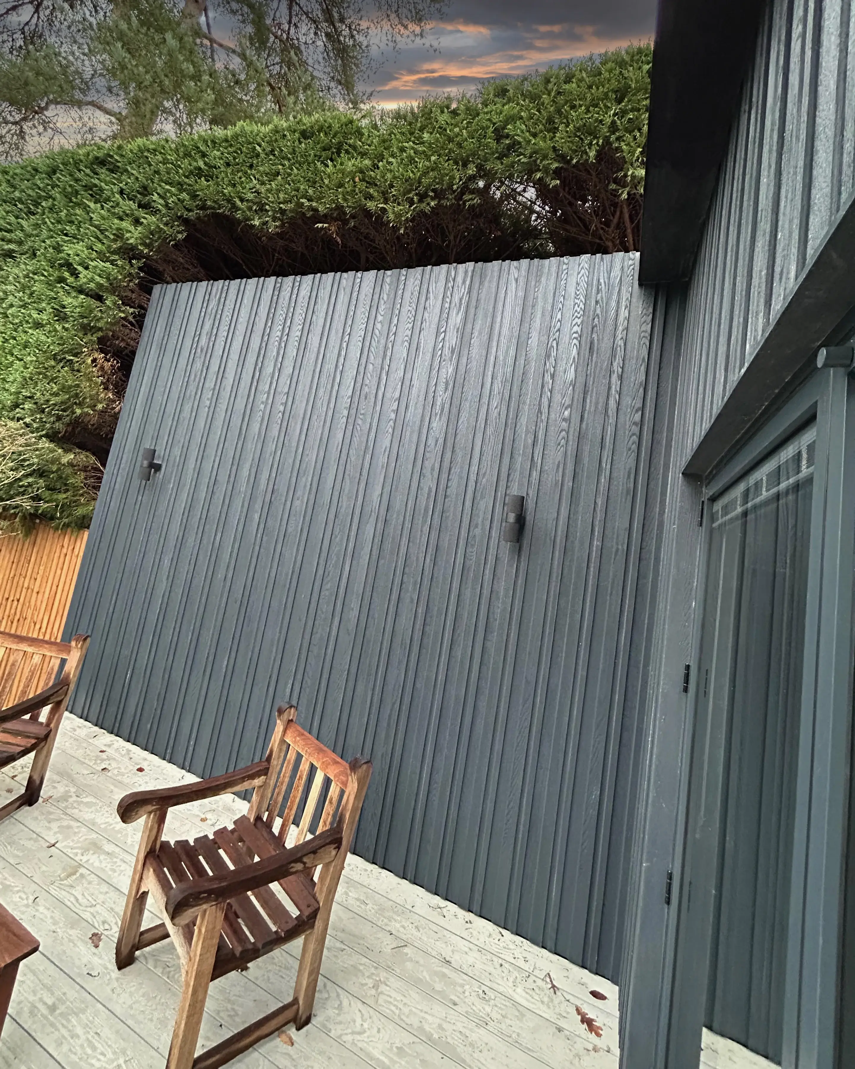 Golf simulator studio exterior detail — charcoal Millboard cladding